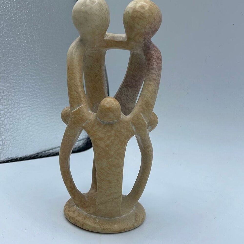 Handcrafted craved soapstone family of 5 circle interlinked.